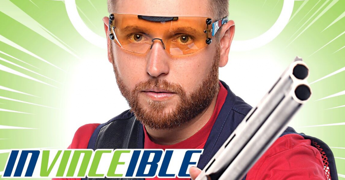 Vnce Hancock holding a gun with the words invincible on the picture.